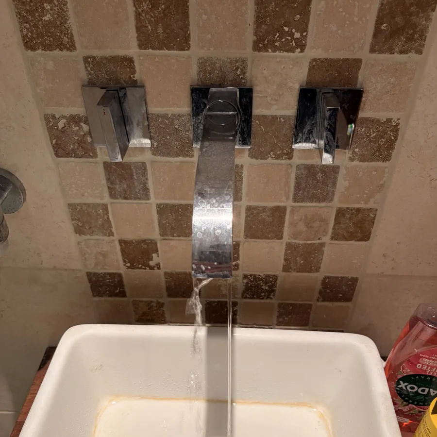 A wall-mounted basin tap