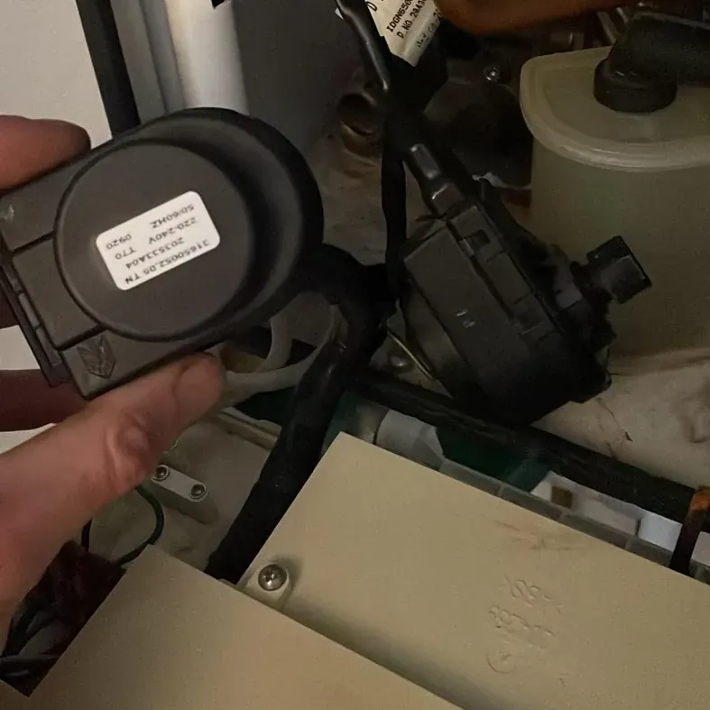 A diverter valve being replaced in a combi boiler