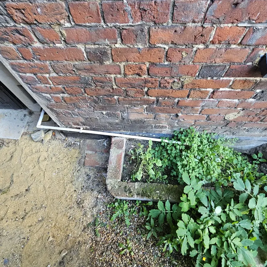 A condensate pipe run outside that has frozen