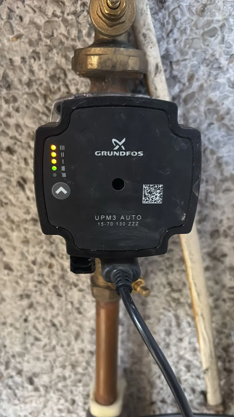 A central heating circulation pump on pipework