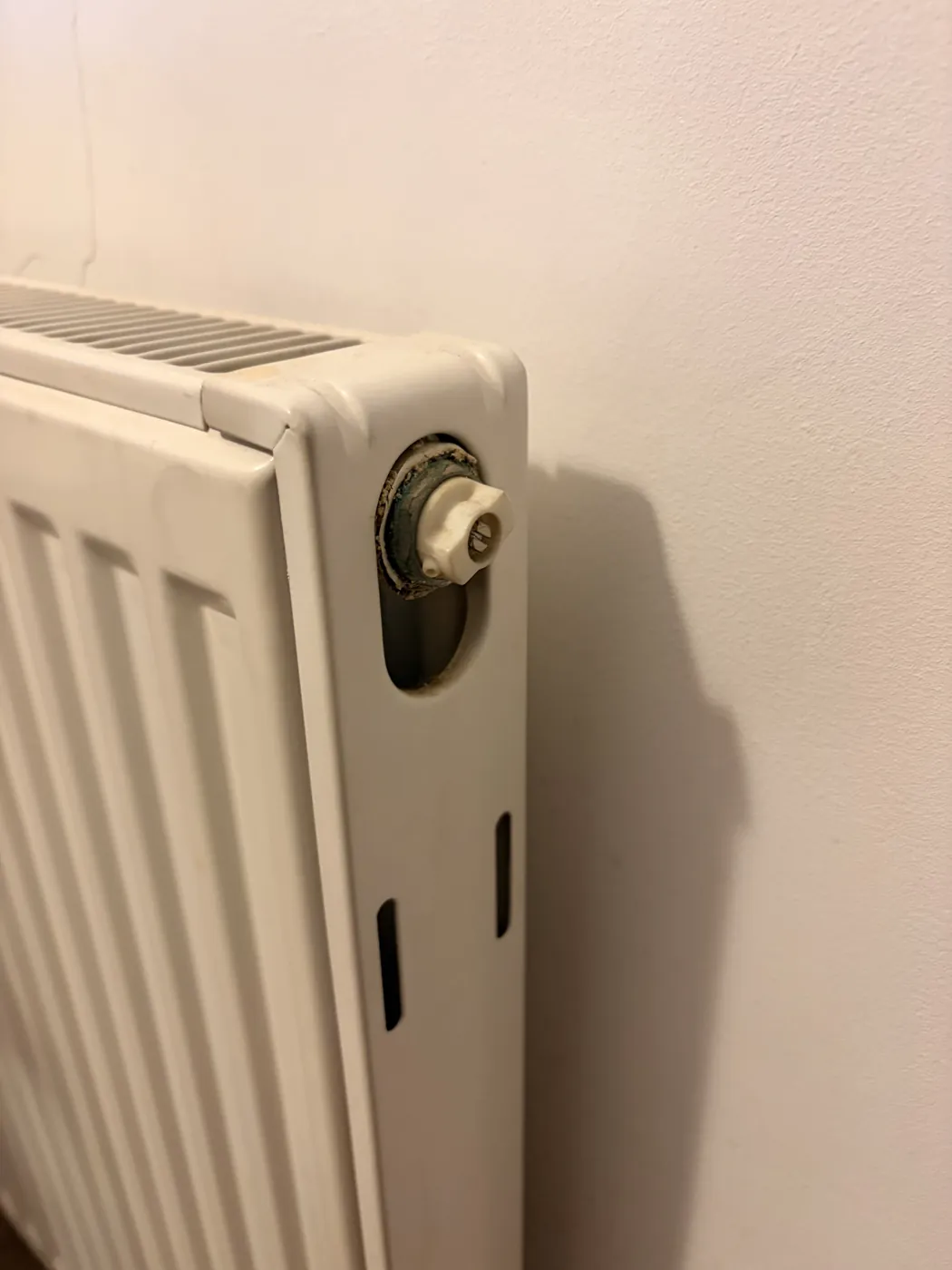 The bleed valve on the top corner of a radiator