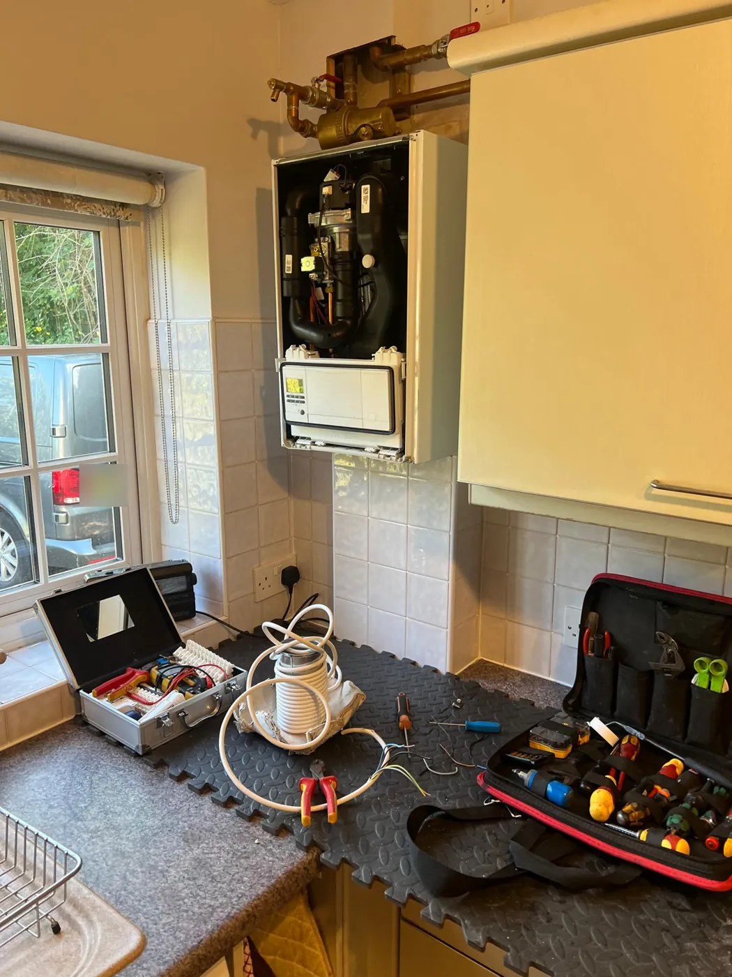 A Vaillant boiler with the front cover off during a repair
