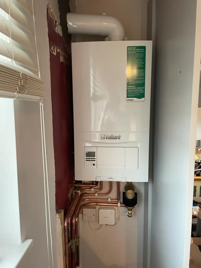 A new Vaillant combi boiler fitted with a magnetic filter on the pipework