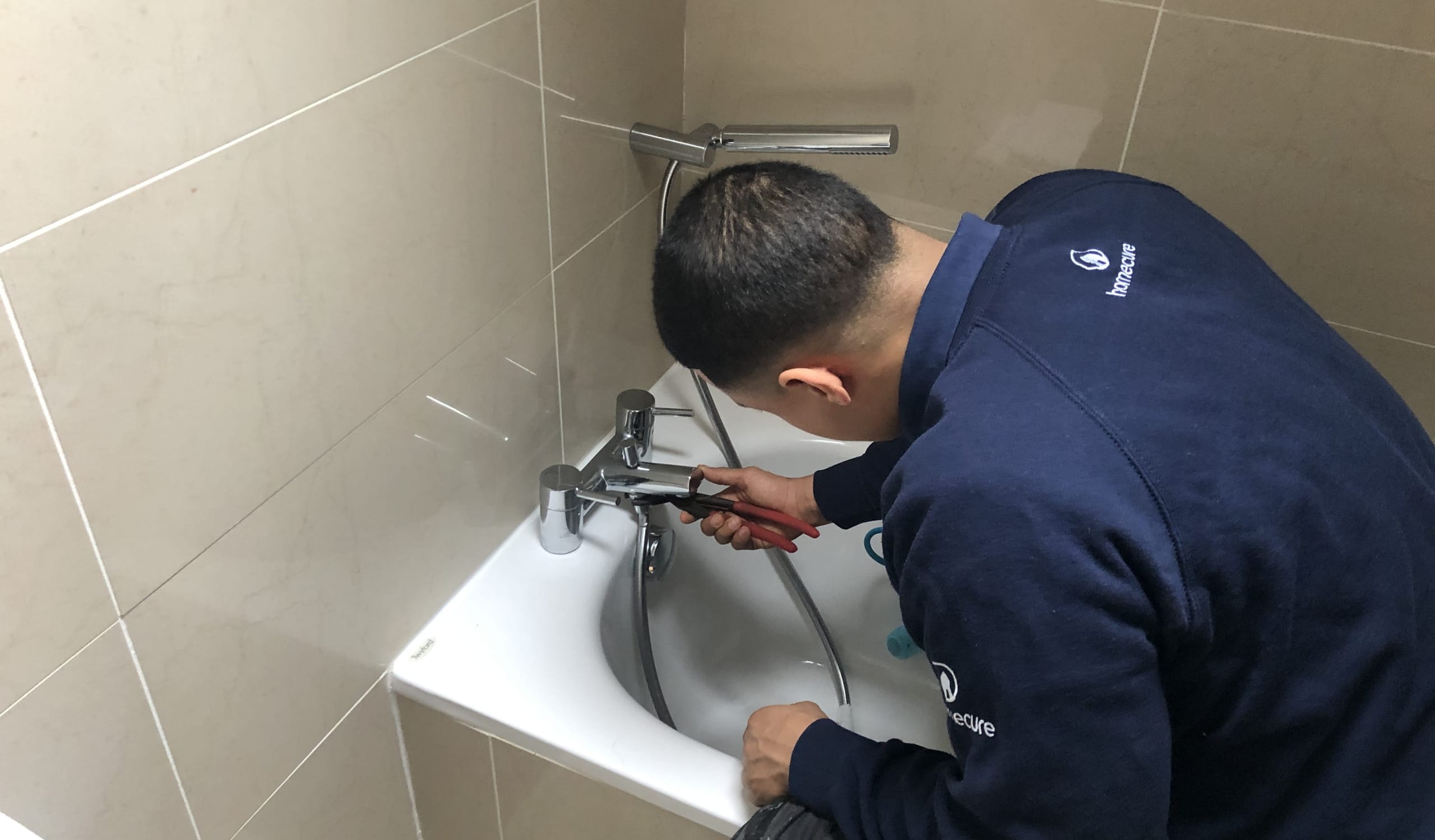 Our quick response, professional plumber in London fixing a leaky tap.