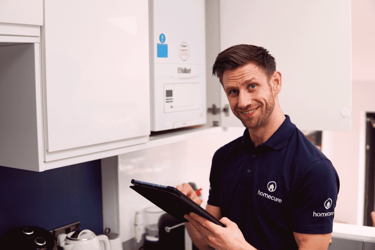 [city] Power Flush engineer working at a customer's home.